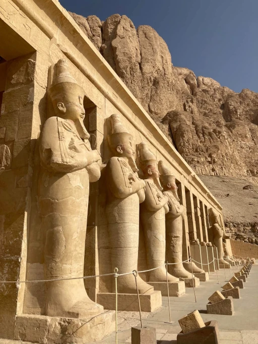 Statues of Queen Hatshepsut at her mortuary temple in Luxor, Egypt